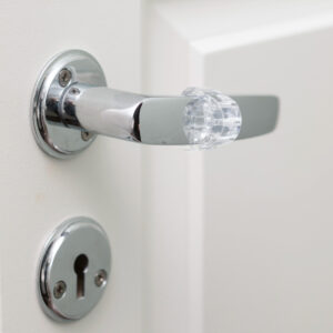 Butée de porte pour poignée